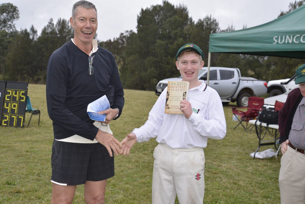 Former Australian coach John Buchanan presents the player of the match award for the Lew Cooper Invitation side to Isaac Lucas after the game against Maryvale at Maryvale. Photo Gerard Walsh / Warwick Daily News